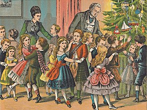 Woonkamer vol keurig geklede kinderen die bij de kerstboom dansen.jpg